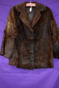 A vintage ladies fur coat, feels to be pony or similar, chestnut brown in colour and fully lined,