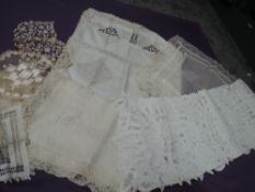 A small lot of antique table cloths, mats and more, different delicate techniques used throughout.