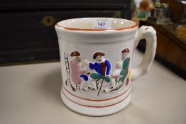 a large stone ware mug with internal frog figure