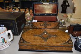 An impressive desktop writers set in veneered burr walnut having brass fitments and compartmental
