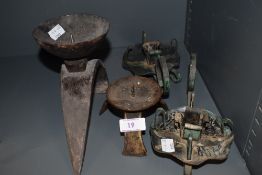 A selection of cast and wrought iron candle sticks