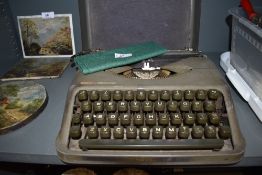 A portable typewriter by Empire The Aristocrat