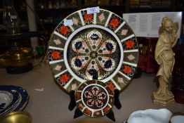 A Crown Derby plate and smaller trinket bowl in the Imari pallete.