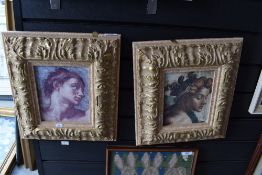A pair of classical prints on shabby chic frames.