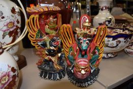 A pair of wooden Chinese figures.