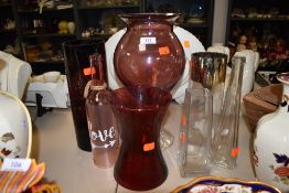 A selection of coloured glass vases and similar