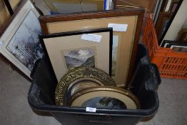 A selection of original art and prints and a round brass edged bevelled glass mirror.