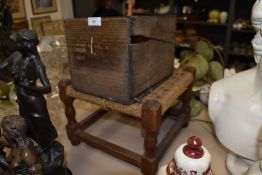 A cobblers last in vintage wooden box with oak framed stool