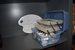 A selection of artist supplies and equipment including acrylics