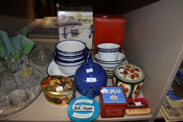 An assortment of vintage enamel bowls and dishes, also including advertising tins and,tea pot and