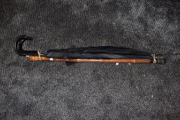 A selection of umbrella and a bamboo walking cane