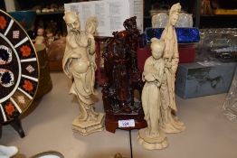A selection of Chinese style figures including red monk figure