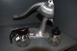 A selection of west German atomic styled kitchen wares including fruit press and condiment set