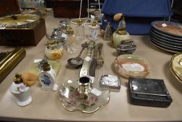A selection of smoking and dressing table items including lighters scent bottles and cutlery