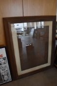 An antique large size pine and wood mounted frame