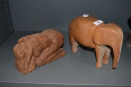 A hand carved figure of a nude lady praying and similar African elephant
