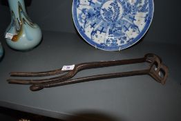 A vintage wrought iron branding iron for letter B and similar large fork