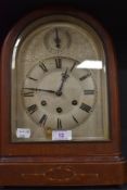 An early 20th century bracket clock having arched dial face and case with chime by Gustav Becker