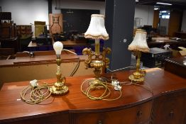 A three lamp set of plaster gilt table lamps