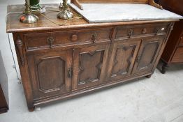An early 20th Century oak low sideboard/dresser base, with approx. 152cm