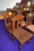 Two ecclesiastical pitch pine communion chairs.