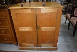 A golden oak side cabinet having semi fitted interior, width approx 97cm, depth 53cm, height 104cm