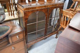 An early 20th Century flame mahogany display cabinet , on ball and claw feet, width approx. 100cm