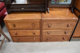 A pair of vintage golden oak three drawer bedroom chests, possibly Gomme (G Plan), having lovely