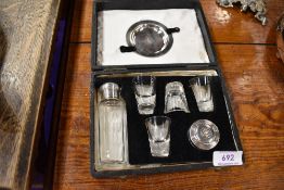Portable early 20th century cased ecclesiastical communion set, comprising of bottle, glasses and