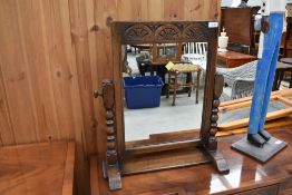 A reproduction oak dressing table mirror, Titchmarsh and Goodwin or similar, width approx. 50cm