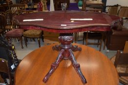 A reproduction Italian style coffee table on carved triple splay pedestal, width approx. 98cm