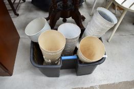 A selection of vintage plastic umbrella stand style planters