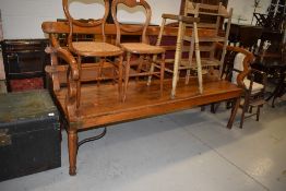 A large hardwood bench with brass and iron fixings , of Indian origin, quite possibly from railways,