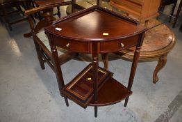 A reproduction mahogany effect corner hall table having dummy drawers, and a small display case