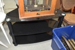 A glass TV stand, width approx. 80cm