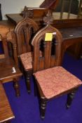Two ecclesiastical gothic styled oak communion chairs.