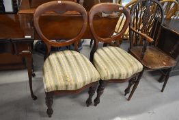 A pair of Victorian mahogany balloon back dining chairs