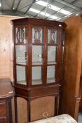 A late 19th/early 20th Century Art Nouveau mahogany display cabinet the glazed upper section with