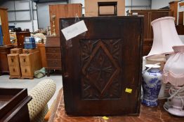 A 19th Century oak carved cabinet, dimensions approx. W35cm D36cm H44cm