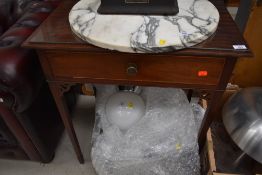 An Edwardian mahogany side table having frieze drawer , fretwork detail and square tapered legs,