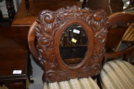 A 19th Century carved oak mirror, width approx. 45cm