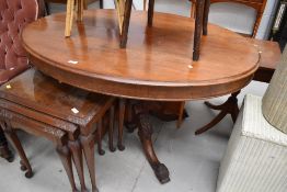 A Victorian mahogany loo style dining table on carved quadruple splay legs, width approx. 130cm
