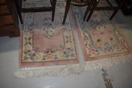 Two modern Chinese rugs, approx. 100cm x 60cm each (not including tassles)