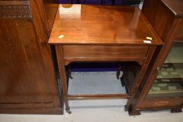 An Edwardian mahogany side table/trolley having line inlay decoration and frieze drawer, width