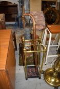 An Edwardian brass four compartment stick stand having cast base, height approx. 63cm