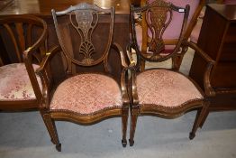 A pair of beautifully inlaid Edwardian mahogany vase back salon armchairs, on square tapered legs