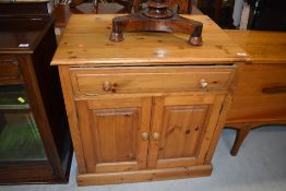 A modern pine TV cabinet, approx. dimensions W81cm D55cm H83cm