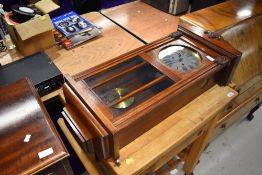 An early 20th Century mahogany cased wall clock, height approx. 77cm