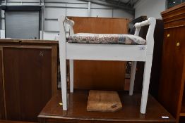 A painted piano stool