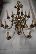 A vintage brass electroleir light fitting